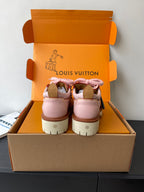Pair of pink Louis Vuitton sneakers from back, showing heel tabs and white tread sole