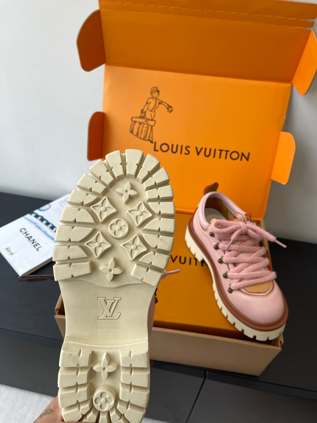 Louis Vuitton sneaker outsole view with white tread and LV monogram on the sole