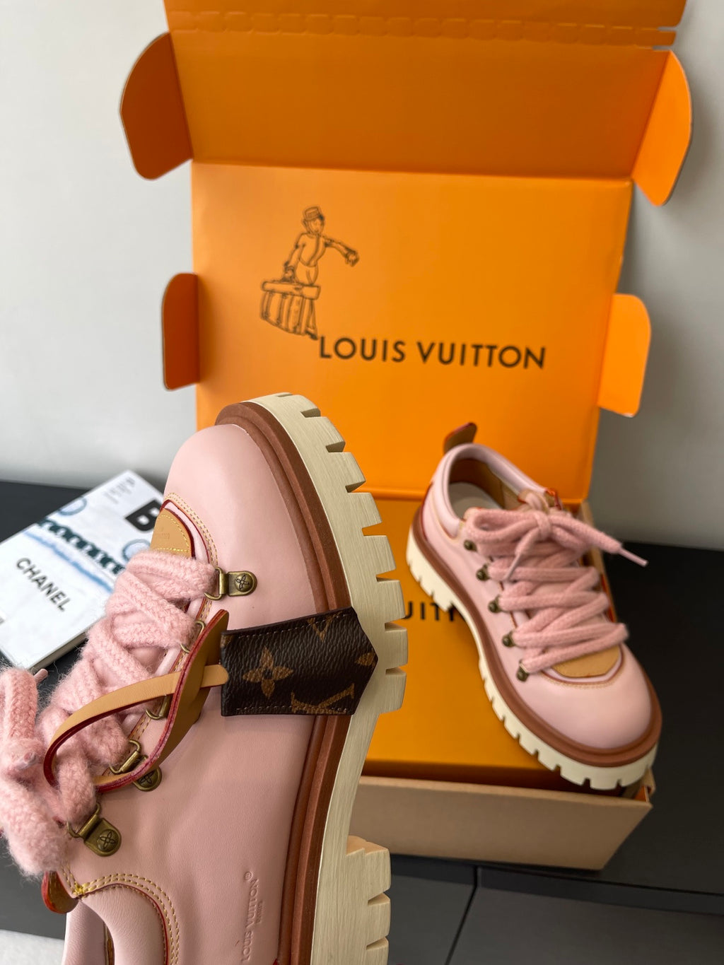 Pink Louis Vuitton sneakers back view, heel tab and lace-up front with lug sole