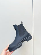 Dark navy ankle Chelsea boot with elastic panels and chunky ridged sole