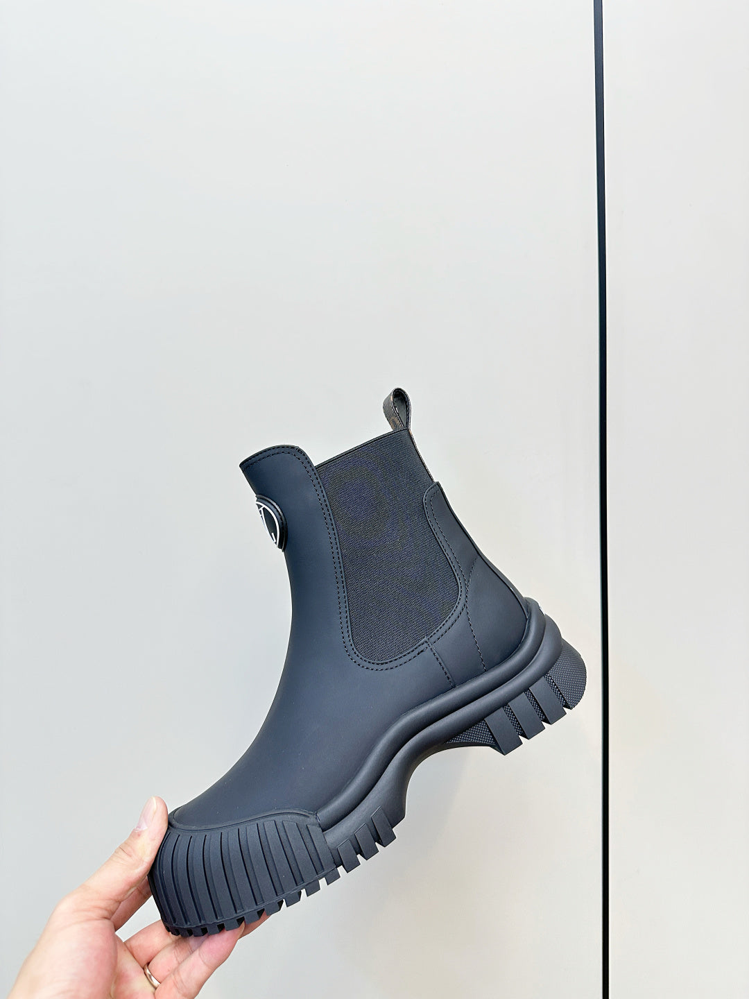 Dark navy ankle Chelsea boot with elastic panels and chunky ridged sole