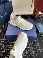 White slip-on sneaker with neon-green logo stripe and Dior heel tab