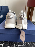 White back view slip-on sneakers with neon-green logo and Dior branding