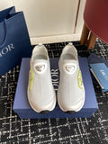 White slip-on sneakers with green logo accents and Dior heel patch, unisex