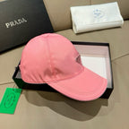 Prada pink cap angled view with triangular logo patch and curved brim.