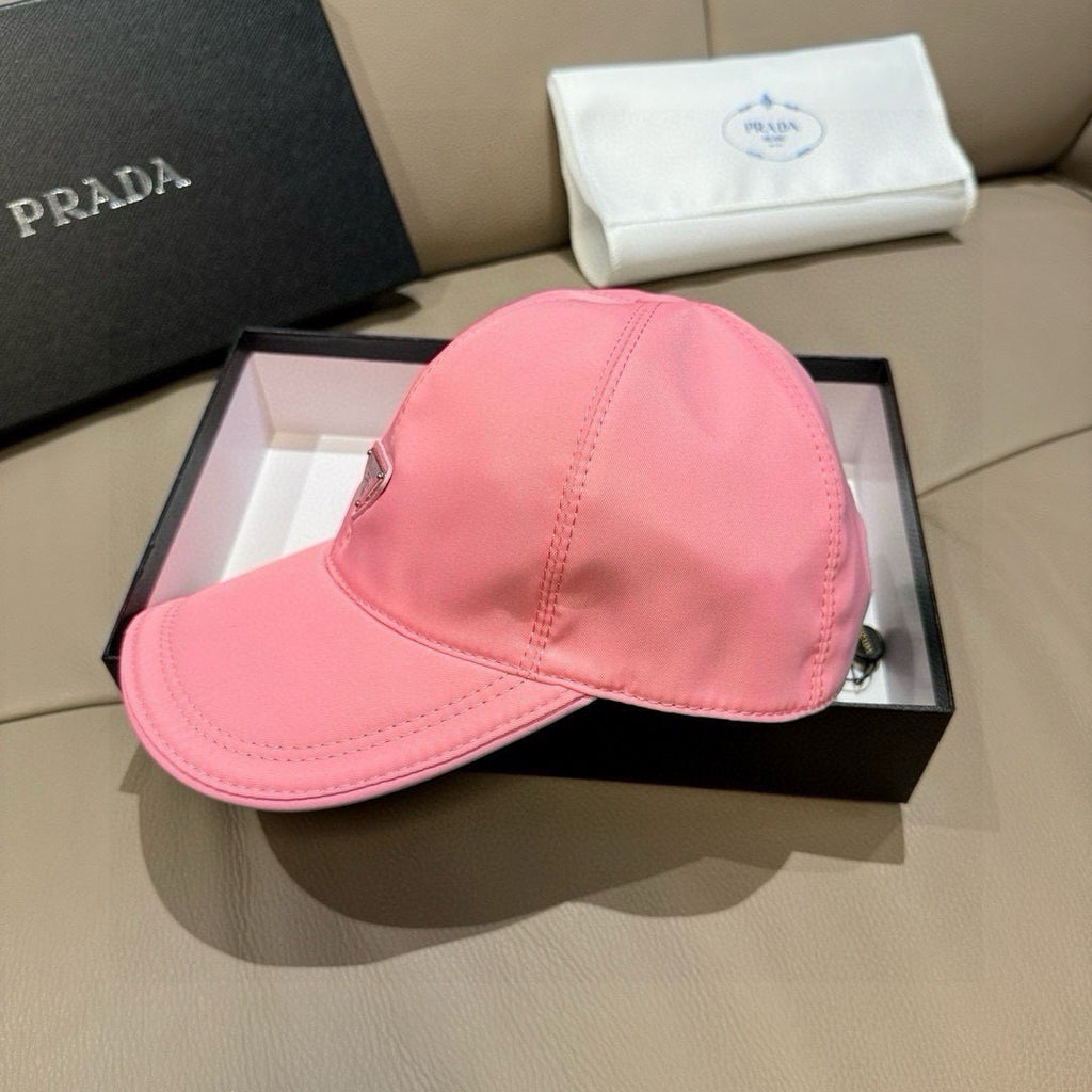 Prada pink cap with curved brim and stitched crown, logo patch on front.