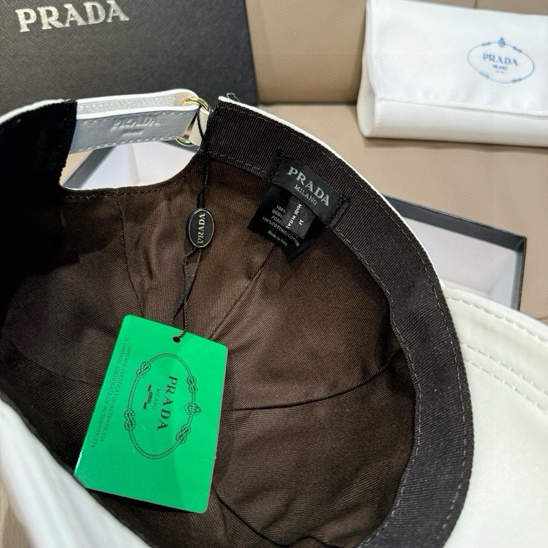 Black baseball cap with Prada label and attached green price tag inside.