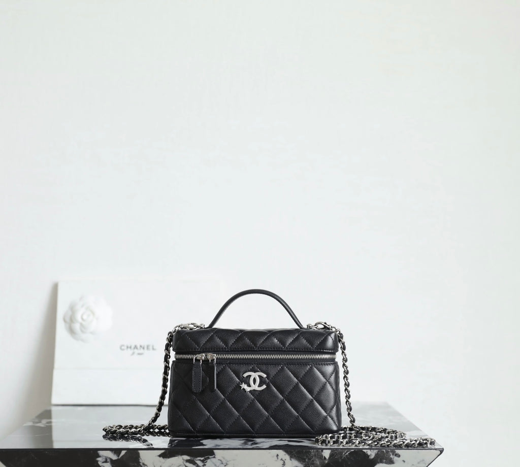 Chanel quilted handbag with top handle and chain strap, black