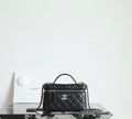 Chanel quilted handbag with top handle and chain strap, black