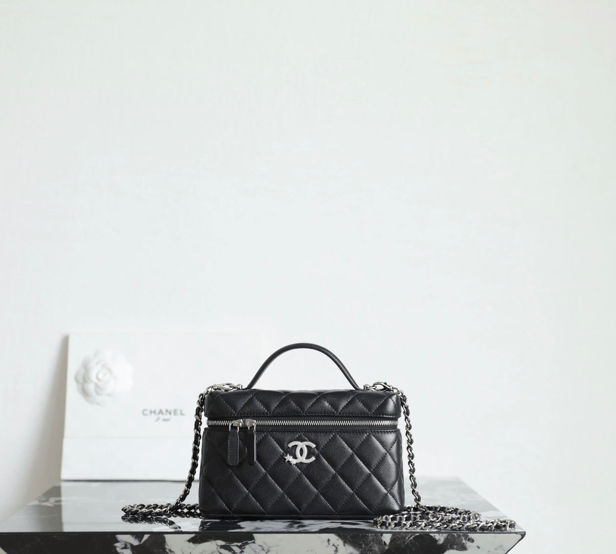 Chanel quilted handbag with top handle and chain strap, black