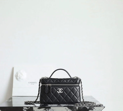 Chanel quilted handbag with top handle and chain strap, black