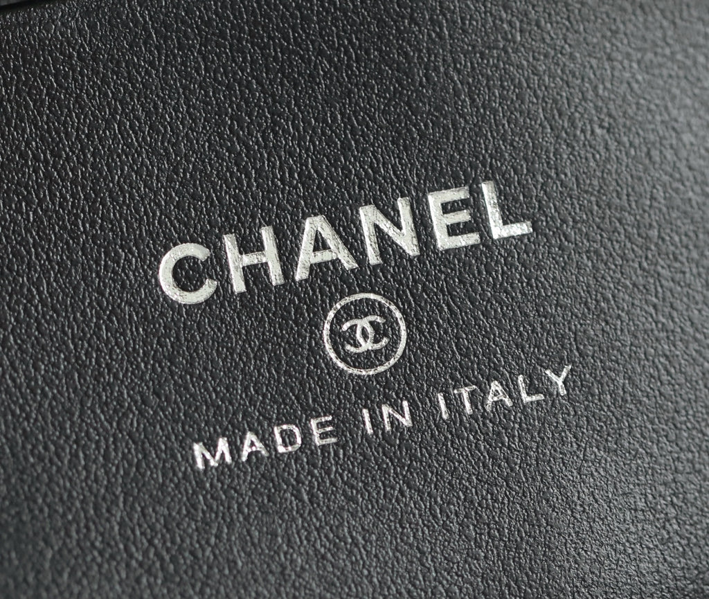 Chanel logo and "Made in Italy" stamped on black leather lining
