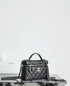 Chanel quilted handbag with chain strap and front logo emblem, black