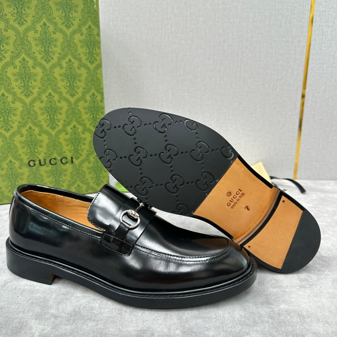 Gucci unisex leather loafer shoes in black, outsole view with embossed pattern