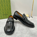 Gucci unisex loafers, black leather, horsebit strap, low heel, slip-on.