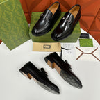 Gucci leather loafers, black with silver horsebit, two pairs on display