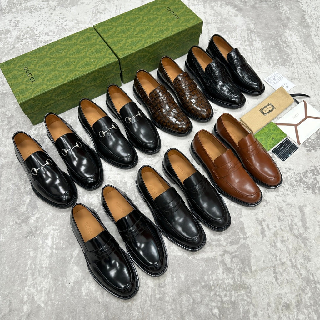 Assorted Gucci loafers, black and brown, varied textures with horsebit styles