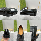 Unisex black leather loafers, heel and toe views with strap across top