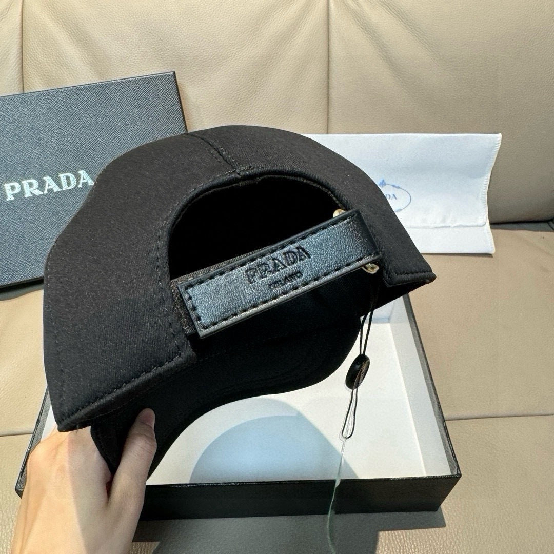 Black baseball cap with front label patch and eyelet detail on brim.