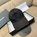 Black baseball cap with stitched front panel and embossed logo patch.