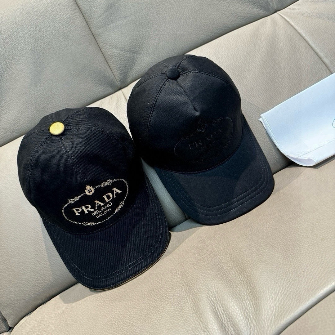 Pair of black baseball caps with round crown button and front embroidered logo.