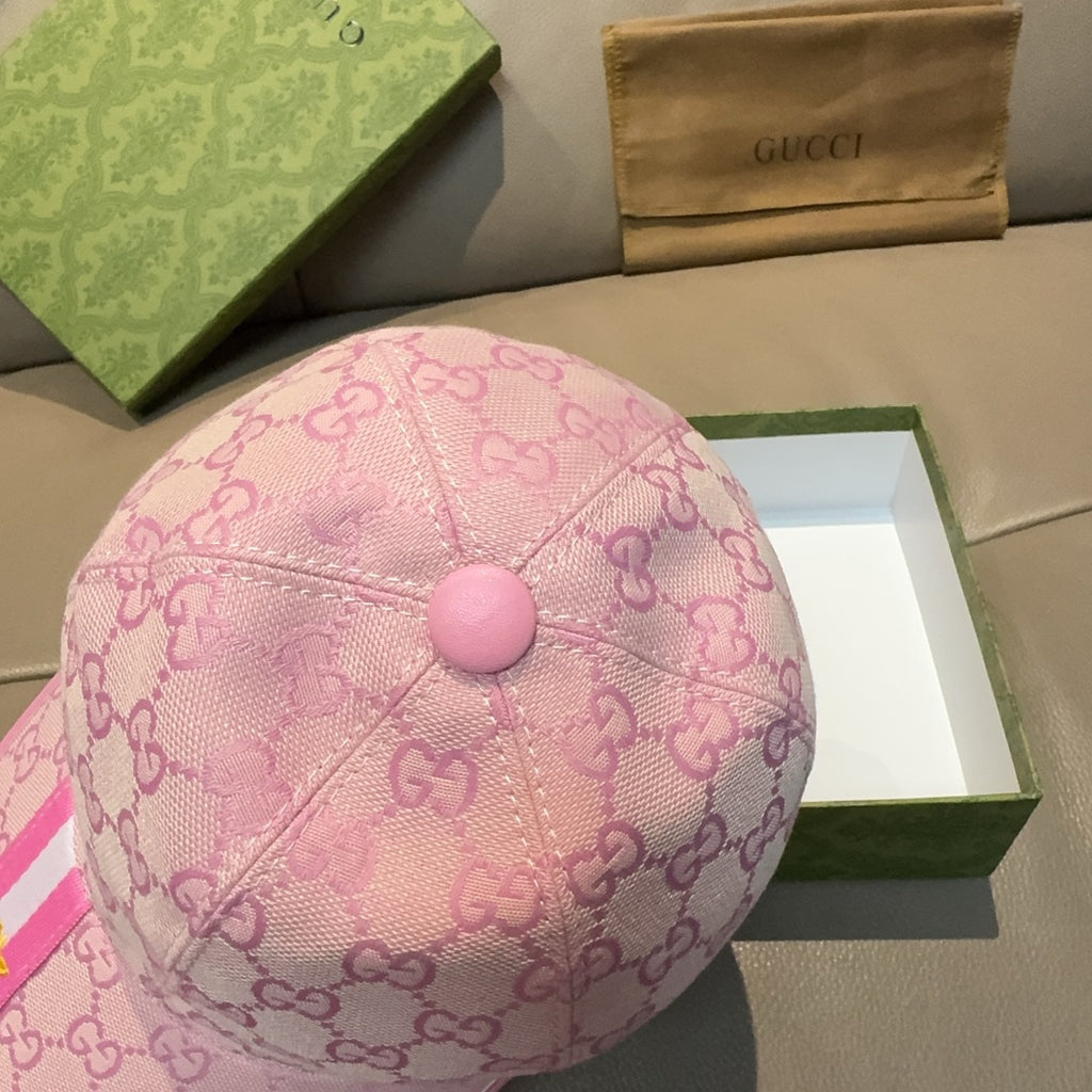 Gucci pink GG monogram cap with round button on top and curved brim