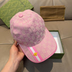 Gucci pink GG monogram baseball cap with pink brim, stripe detail, and gold bee