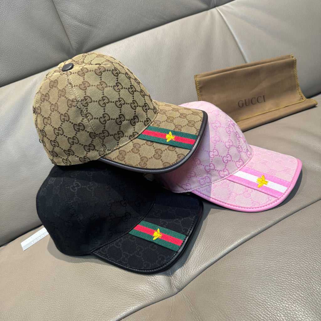 Gucci caps assortment: pink and beige GG caps with striped Web trim, plus black cap