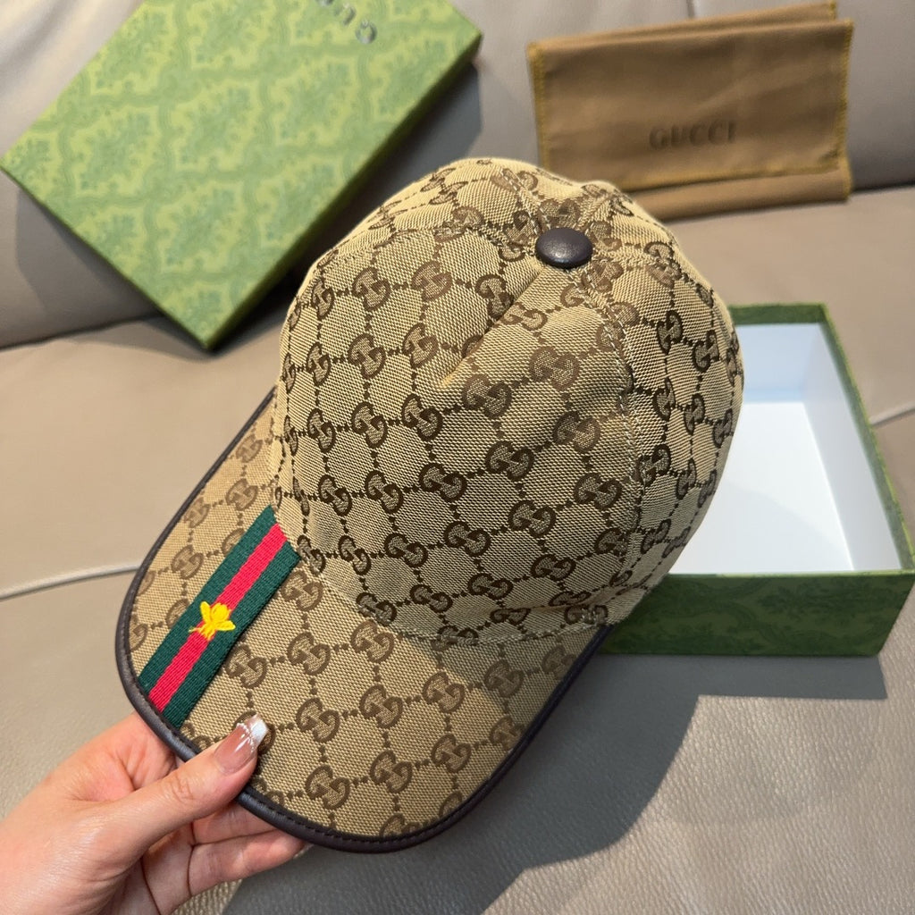 Tan Gucci baseball cap with GG pattern and green/red stripe on front panel