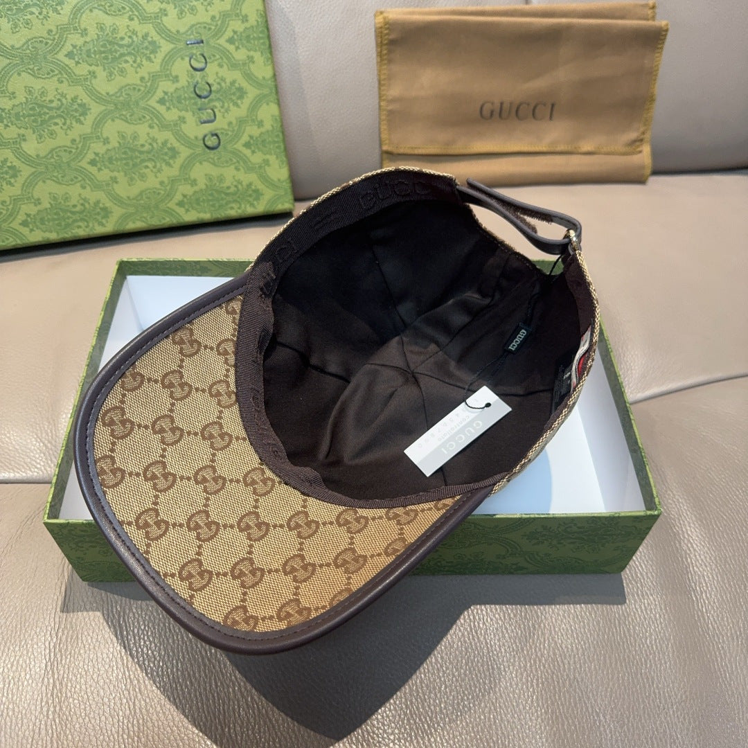 Gucci baseball cap with tan GG brim and black interior crown, tag visible inside