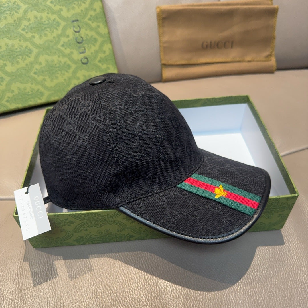Black Gucci baseball cap with GG pattern and Web stripe with gold bee emblem