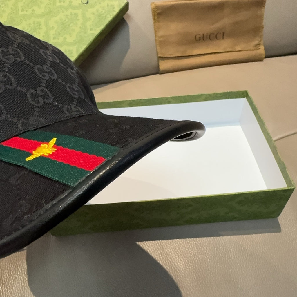 Black Gucci baseball cap showing Web stripe on front and stitched brim