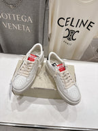 White lace-up sneakers with red tongue label and leopard side panel detail