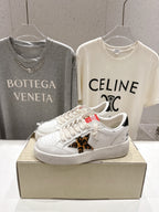 White sneakers with leopard-print side patch and lace-up laces