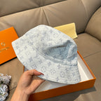 Louis Vuitton bucket cap in light blue with monogram pattern, front side view
