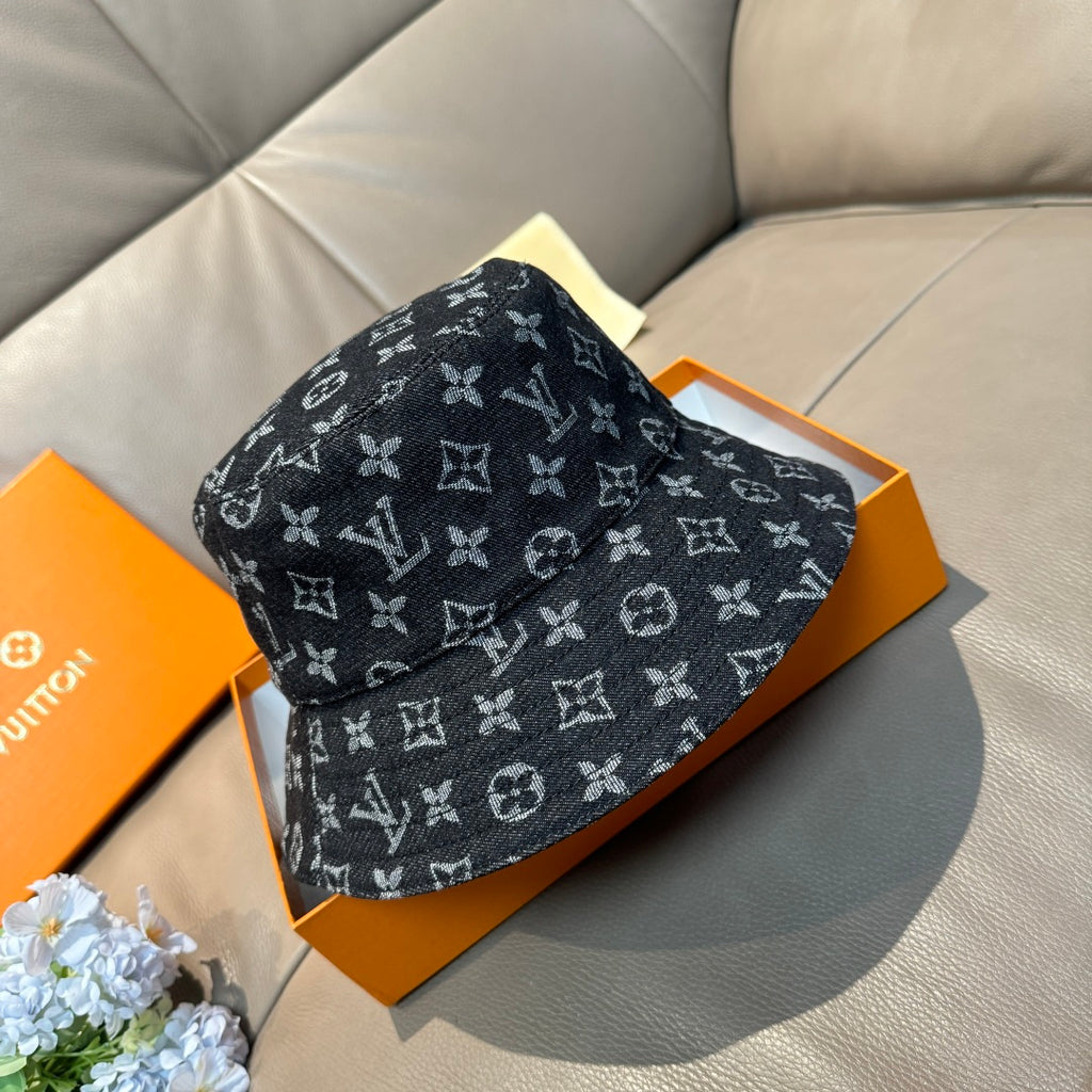 Louis Vuitton bucket hat in dark monogram print, front-left angle, curved brim.