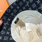 Louis Vuitton bucket hat interior view with cream lining and attached labels.