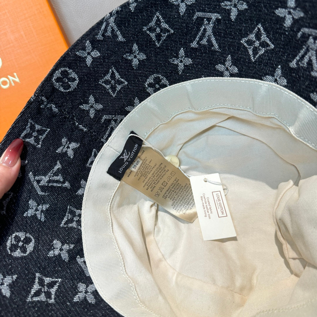 Louis Vuitton bucket hat interior view with cream lining and attached labels.