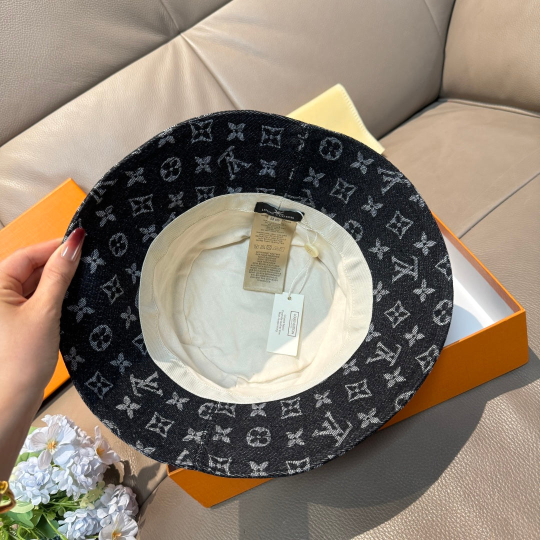 Louis Vuitton bucket hat with dark monogram exterior and light interior lining.