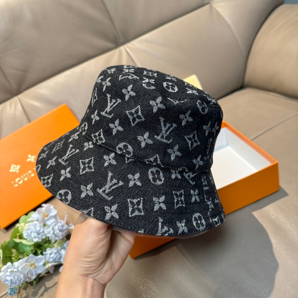 Louis Vuitton bucket hat with dark monogram pattern, side view, curved brim.