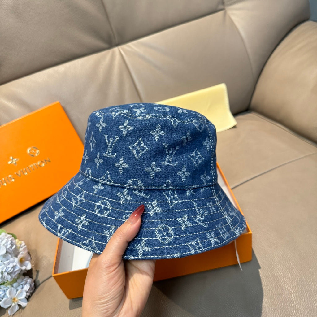 Louis Vuitton denim-blue monogram bucket hat, front crown and brim detail.