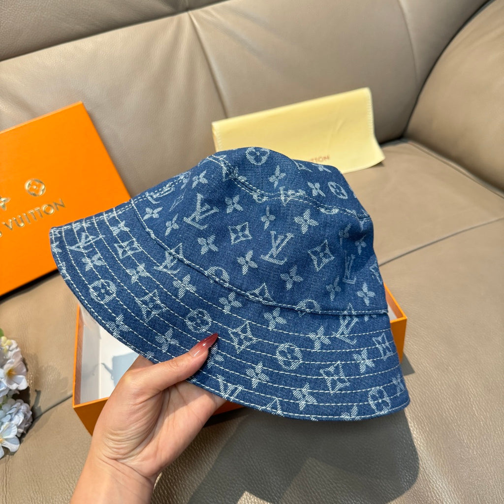 Louis Vuitton denim-blue monogram bucket hat, three-quarter view.