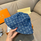Louis Vuitton denim-blue monogram bucket hat, three-quarter view.