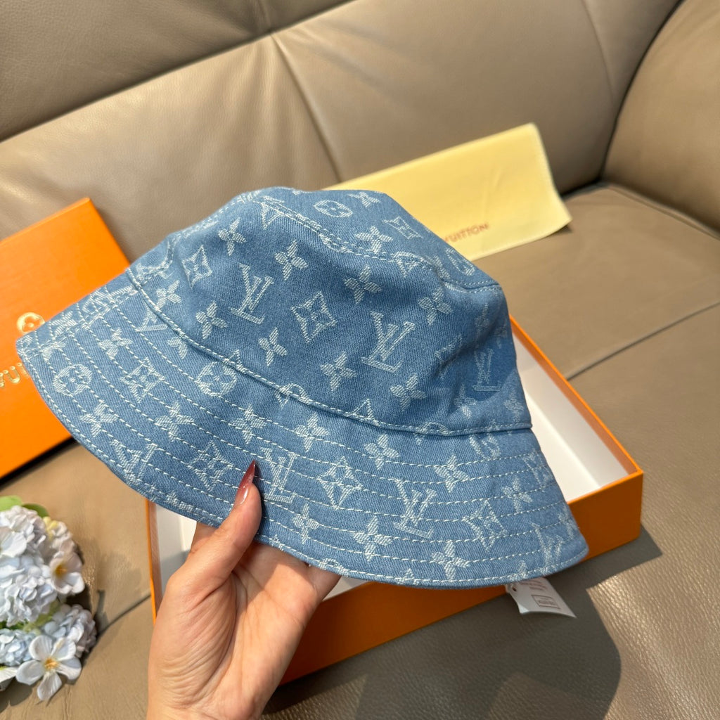 Louis Vuitton blue monogram bucket hat with curved brim, side angle