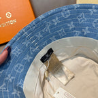 Louis Vuitton blue monogram bucket hat with inner band and attached tags