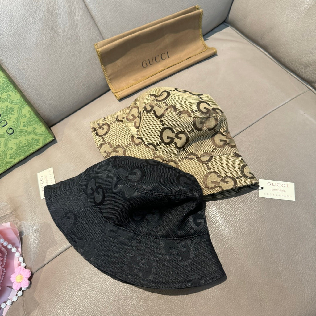 Tan and black GG monogram bucket hats, one tan on top and black below
