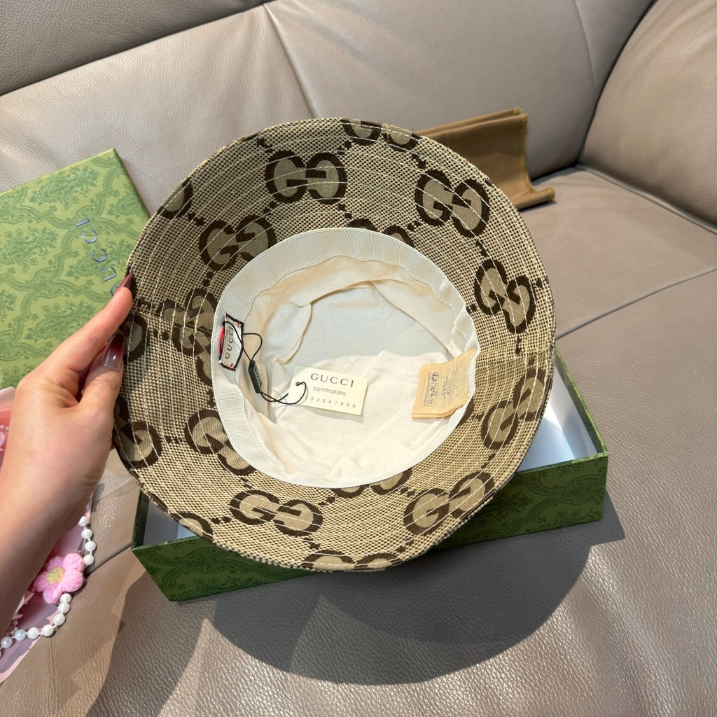 Tan GG monogram bucket hat with inner label visible and white interior lining