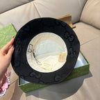Gucci bucket hat interior lining in light color, front hat opening shown.