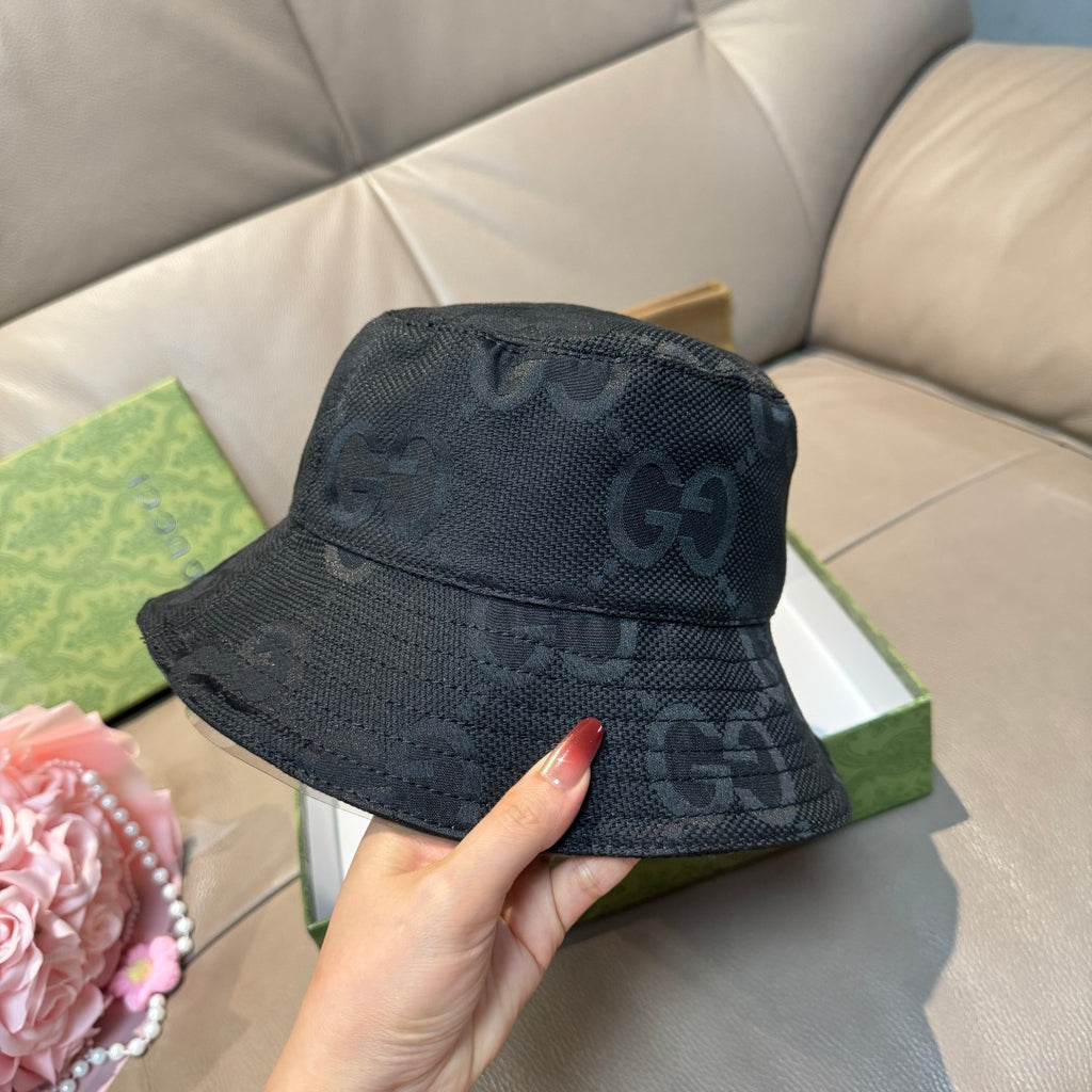 Gucci bucket hat, dark GG monogram print, with curved brim and crown.