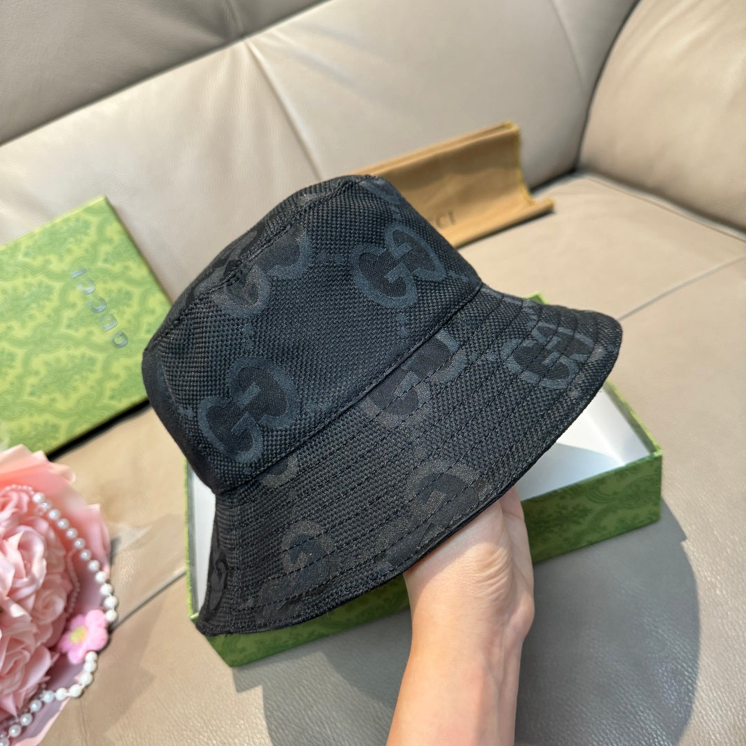 Gucci bucket hat, dark textured GG monogram pattern on the front panel.
